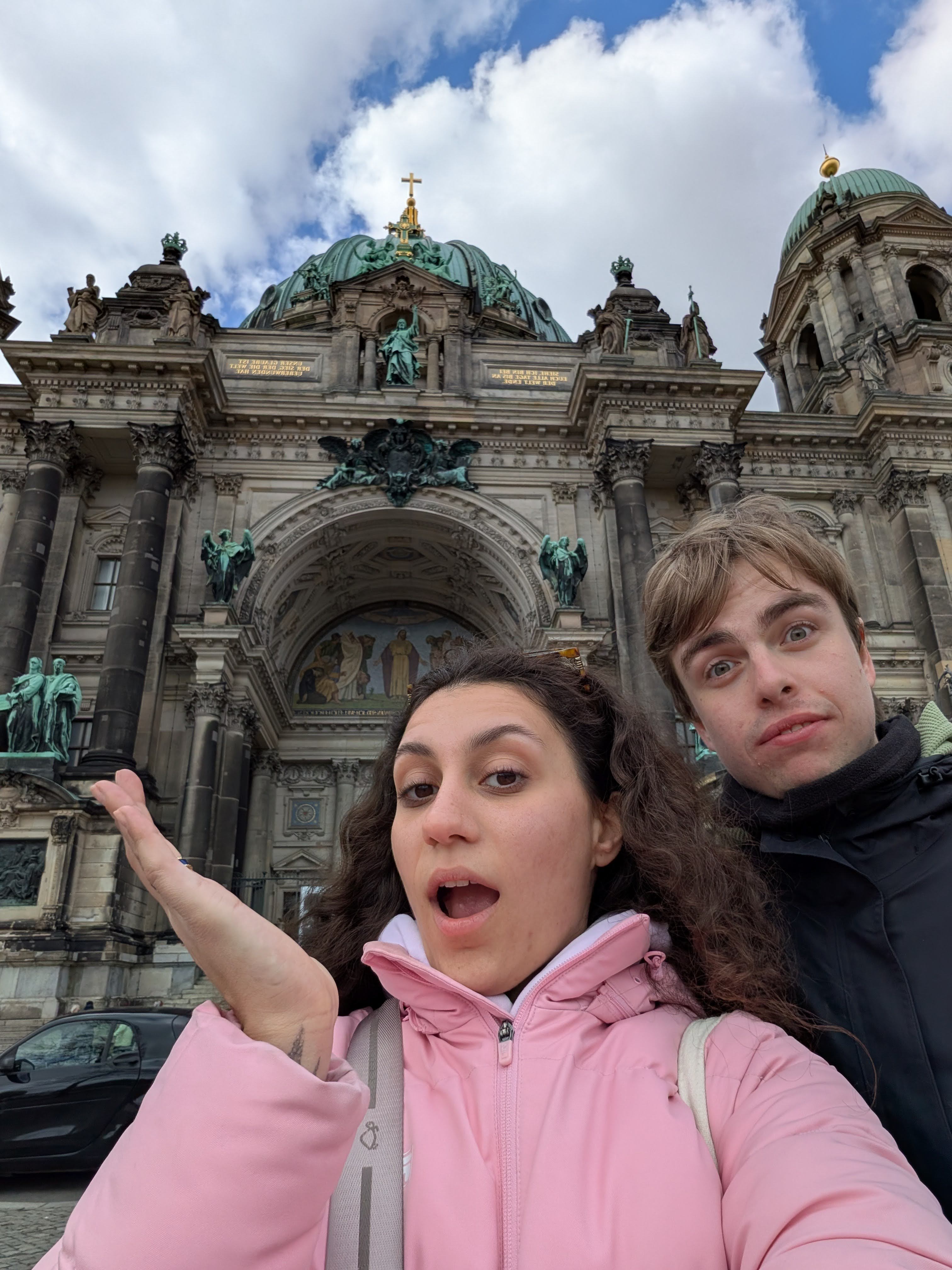 Us in front of building